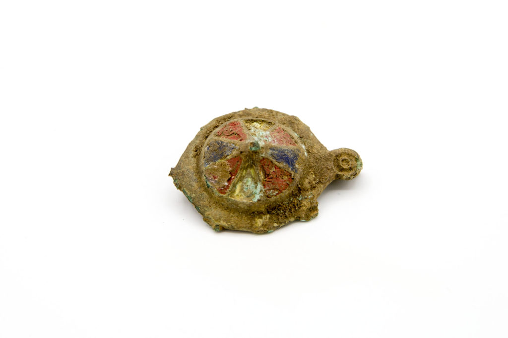Continental Roman copper-alloy plate brooch with enamelled decoration and animal head terminals, 2nd century (c) Highways England, courtesy of MOLA Headland Infrastructure