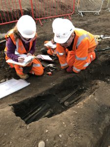 Fig 1 An MHI osteologist advising an archaeologist on the excavation of a burial at Park Street, Birmingham