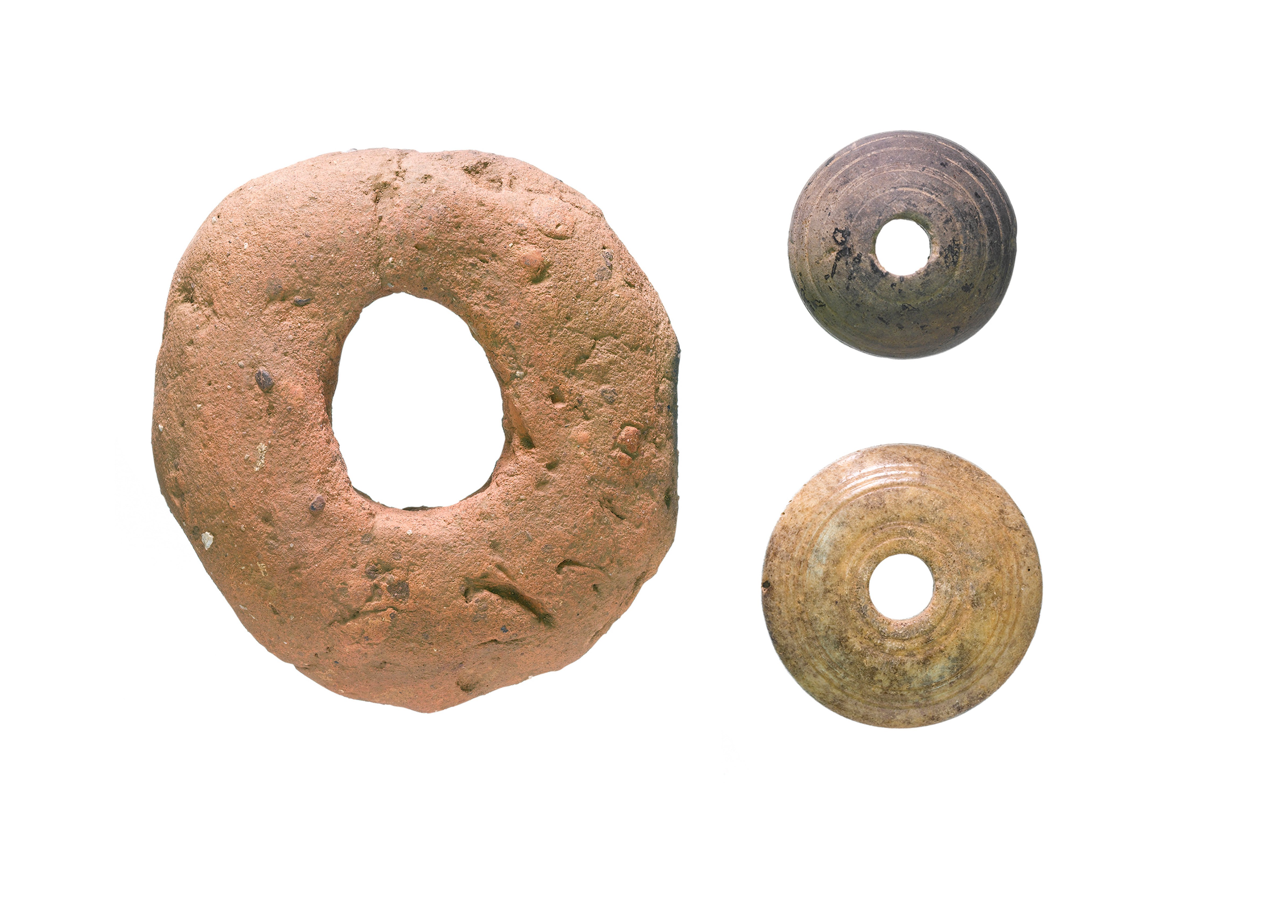 Left- Anglo-Saxon clay loomweight. Right - Stone and bone spindle whorls - both ...4787 x 3435